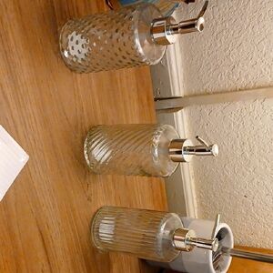 Set of Three Glass Soap Dispensers with Silver Pumps